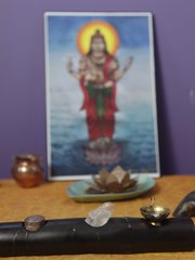 An altar with the image of Lord Dhanvantari, the god of health care and regarded as the source of Ayurveda, is displayed inside the studio space of Ayurveda practitioner Laura Martin-Eagles studio.