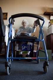 Mary Blythe, a resident of Babcock Place in Lawrence, uses a walker to get around, making it a challenge to visit friends and relatives. If she ever lost her ability to walk with a walker, it would be even harder to go see people, she says.