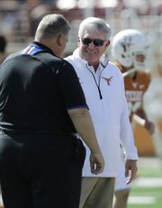 Kansas coach Charlie Weis, left, and Texas coach Mack Brown visit prior to their Nov. 2 game in Austin, Texas.