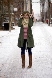 Emily Kennedy sports an oversized anorak jacket with faux fur trim ($128) from Eccentricity, along with skinny jeans ($89), a striped shirt ($38) and a scarf ($24).