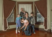 Tresa McAlhaney, a Lawrence native, is running for governor in 2014 as a libertarian. She is pictured holding daughter Emma, 2, at the family's Bonner Springs home on a recent day with, from left, daughter Natalie, 12, husband Michael, 10-month-old daughter Maegan, and son Logan, 8.