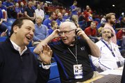 Radio broadcaster Bob Davis gets into conversation with color commentator Greg Gurley prior to the Jayhawks' tipoff against Georgetown on Saturday, Dec. 21, 2013 at Allen Fieldhouse. Davis is in his 30th year of broadcasting Kansas basketball games. At right is technician Bob Newton.