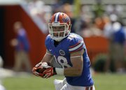 Kent Taylor looks to run for extra yardage during a Florida football spring scrimmage on Saturday, April 6, 2013, in Gainesville, Fla.