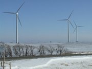 Wind turbines like these could soon be used to produce power for utility companies in the eastern United States. Clean Line Energy Partners, a Texas company, is proposing a high voltage direct current transmission line to run from Dodge City, across Kansas, Missouri, Illinois, and into Indiana. The Kansas Corporation Commission approved the Kansas portion of the project in November, but opponents still hope to block it.