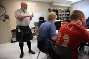 Paul Corcoran, who teaches sixth-grade math and language arts at Lawrence's West Middle School, wears kilts to school most days of the week to celebrate his Irish heritage.