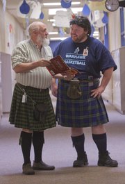 From left, Paul Corcoran and Holden Kraus both teach math at Lawrence's West Middle School and often wear kilts to class. Students are convinced they're father and son (they're not).