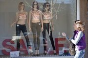 A creative window display tries to entice passersby to shop for sale items at Weaver's Department Store, 901 Massachusetts St., on Tuesday, Jan. 14, 2014.