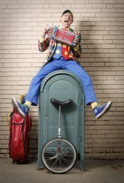 Lawrence busker Richard Renner has been known to juggle, play an accordion, and ride a unicyle. Renner is the creator of the Lawrence Busker Festival.