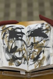 A journal containing the visual art of author William S. Burroughs, shown here, will be on display at Kansas University's Spencer Research Library along with personal journals that were the source of his last book. Photo courtesy of KU/Chuck France.