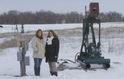 Neighbors Sara Yardley, left, and Amy Adamson live southeast of Baldwin City and are concerned abut the number of oil wells that are on their property and about the prospect of more being drilled too close to their homes.