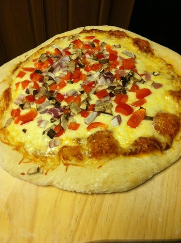 More traditional pizza: Red sauce, cheese, red pepper, red onion and mushrooms.