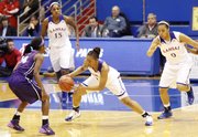 Kansas guard Cece Harper, (24) center, comes up with steal during the Jayhawks' victory against TCU, Wednesday, Feb. 12, 2014, at Allen Fieldhouse.