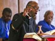 The Rev. Verdell Taylor Jr. delivers a sermon during a worship service at St. Luke AME church, 900 New York St., on Sunday, Feb. 16, 2014.