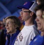 Rosalie Gerstner and her grandson Brian Gerstner sing the Alma Mater prior to the Jayhawks' tipoff against TCU on Saturday, Feb. 15, 2014, at Allen Fieldhouse.