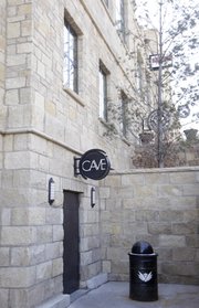 Exterior Indiana Street entrance to the Cave at the Oread Hotel. The Cave nightclub is located at the bottom of The Oread and features two full bars, multiple lounges, state of the art lighting and sound systems, limestone walls, and granite stands, tables, and booths.