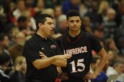 Lawrence High coach Mike Lewis talks with junior Anthony Bonner (15) on Friday, Feb. 28, 2014, at FSHS.