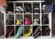 Max Greenwood used some salvaged shelves to create slots for shoes and purses along the length of one wall in a second bedroom to create a walk-in closet for his fiancee.