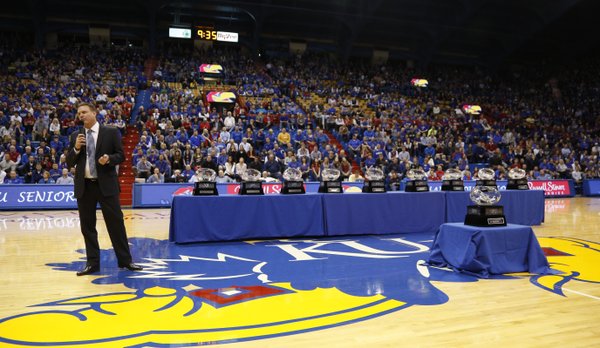 Kansas head coach Bill Self addresses the fieldhouse next to the program's ten consecutive conference titles following the Jayhawks' 82-57 win over Texas Tech.