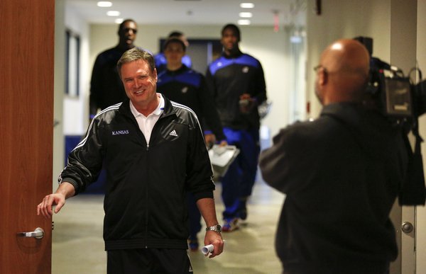 Kansas head coach Bill Self smiles as he walks past a television camera following the NCAA tournament selection show, Sunday, March 16, 2014 at Allen Fieldhouse. Kansas, a No. 2 seed in the South Regional, will face No. 15 seed Eastern Kentucky on Friday in St. Louis.
