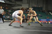 Baker University freshman Bryce Shoemaker, right, wrestles on his way to an NAIA championship on March 8, 2014, in Topeka.