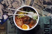 Richard Gwin/Journal World Photo. Ghost Ramen Challenge at Ramen Bowls, 125 E 10th St., a combo of noodles, pork, veggies, an egg and a whole ghost pepper.