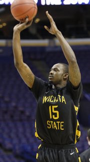 Nick Wiggins, brother of Kansas guard Andrew Wiggins, practices with his Wichita State team during a practice session Thursday at the Scottrade Center in St. Louis.