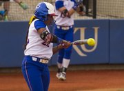 Kansas senior Ashley Newman makes contact for a single in the first inning of Kansas' game against Oklahoma State, Friday at Arrocha Ballpark.