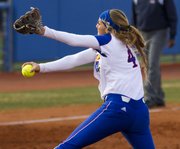 Kansas sophomore pitcher Kelsey Kessler winds up as she delivers a pitch during Kansas' game against Oklahoma State, Friday at Arrocha Ballpark.