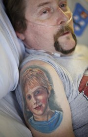 On David Jensen's right shoulder is a tattoo of his 8-year-old son Isaac Hartz-Jensen. Jensen says he and his son often talk about the things they will do together after his transplant.