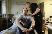 Lawrence resident David Jensen breaths in and out for Dave Dempsey, a registered respiratory therapist at Lawrence Memorial Hospital, Wednesday, April 2, 2014. Jensen, who is a frequent visitor to the hospital, this time for severe bronchitis, suffers from Alpha-1 Antitrypsin Deficiency, is awaiting a double lung transplant. Currently, Jensen says his lungs are operating at less than ten percent of their capacity.