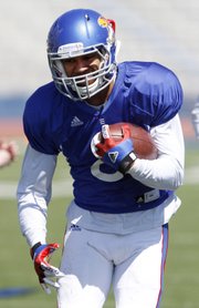 Kansas wide receiver Nick Harwell (8) runs drills during a KU football practice Saturday, April 5, 2014, at Memorial Stadium.