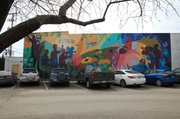 Spencer Museum of Art and a Lawrence-based development group tentatively agreed to have artist Dave Loewenstein recreate his Pollinators mural. The building that it's currently on is scheduled to be torn down and a multi story building will be built in its place.