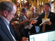 Members of the Kansas Senate discuss whether the chamber's rules allow a debate on a school funding plan before ultimately permitting the discussion to go forward, Sunday, April 6, 2014, at the Statehouse in Topeka, Kan. They are from left to right, Senate Minority Leader Anthony Hensley, a Topeka Democrat; Senate President Susan Wagle, a Wichita Republican; Sen. Tom Arpke, a Salina Republican, and Senate Vice President Jeff King, an Independence Republican.