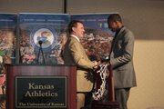 Kansas University men’s basketball coach Bill Self, left, congratulates freshman guard Andrew Wiggins during the Jayhawks’ postseason awards banquet Tuesday, April 15, 2014, at the Lawrence Holiday Inn. Wiggins received the 2014 Danny Manning “Mr. Jayhawk” Award after leading KU’s Big 12 championship team in scoring during his one-and-done season.