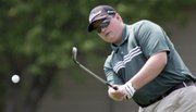 Free State High golfer Coleman Houk pitches onto a green Wednesday at Eagle Bend during the Free State High School Invite golf tournament.