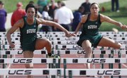 Free State's Gabbi Dabney, left, and Kiara Clark run 1-2 in the prelims in the 100-meter hurdles on Friday, April 25, 2014, at FSHS.