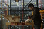 Kansas University graduate student in architecture Michael McKay notches a 2-by-4 for the ceiling structure of an addition to Marvin Hall being completed by McKay and others with the Studio 804 graduate architecture class, Thursday, April 24, 2014, at Marvin Hall.