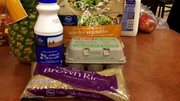 Alma's items:
Grains: Brown rice, $1
Fruits: Pineapple, 99 cents
Vegetables: Frozen stir fry vegetable package, $1.29
Protein: Six eggs, 98 cents
Dairy: 16 oz. bottle of 2 percent milk, 99 cents
Total price: $5.25
Suggestions: Good, solid meal. Since chicken can get expensive, consider canned chicken for the protein. Also, canned or pre-sliced pineapple might be worth the added price for the convenience.