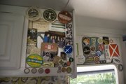 Maria Scarpello and Brian Devine's RV is wallpapered with beer labels from the many places they've traveled.