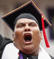 Haskell graduate Leander Blane Loretto, from Jemez Pueblo, New Mexico, sings "Onward Haskell" at the end of the commencement ceremony on Friday at Coffin Sports Complex.