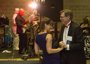 Dale Denning and Kristen Harms show off their dance moves while Billy Ebeling and the Late for Dinner Band provide music at the Hearts of Gold Ball, held May 10, 2014, at the Lawrence Journal-World press building, 608 Massachusetts St. The ball, which is held every two years, serves as a fundraiser for Lawrence Memorial Hospital.