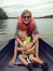 Meryl Carver-Allmond and her son ride a canoe at Shawnee Mission Park last summer, one of the activities on the family’s summer bucket list.