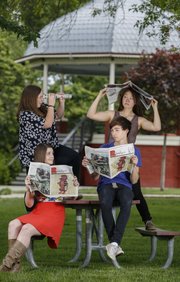 Student journalists and graduating high school seniors clockwise from front left, Ashley Hocking, Lawrence High, Bret Watson, Free State, Hannah Moran, Free State, and Gage Nelson, Lawrence High, are pictured on Wednesday, May 14, 2014 at South Park.