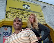 Guy Neighbors, pictured here with his wife, Carrie Neighbors, in a Journal-World file photo, had an indictment dismissed by a federal judge this week.