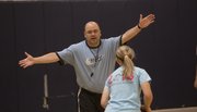 Free State girls basketball coach Bryan Duncan shows some defensive moves at a camp Wednesday, June 4, 2014, at Southwest Middle School.