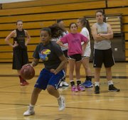 Free State senior Lexci Kimball works on dribbling moves at camp Wednesday, June 4, 2014, at Southwest Middle School.