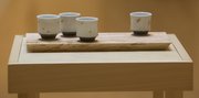 Ceramist Kyla Strid, artist in residence at Lawrence Arts Center, created "buzz cups" for her latest solo exhibition where she parallels the waggle dance of bees to her own life. The "Waggle Dance" exhibition has been open at the Arts Center since last Friday and will run through July 25.