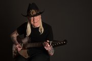Johnny Winter will perform at an outdoor concert outside the Lawrence Arts Center at 8:30 p.m. Wednesday, following the screening of documentary film on his life, "Johnny Winter: Down and Dirty."