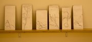 A set of tiles that have renderings of grass stalks that Strid photographed in the winter months for latest solo exhibition "Waggle Dance."