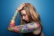 Lawrence resident Kristin Spacek says the inspiration behind her sleeve of flowers is her profession as owner of Owens Flower Shop, 846 Indiana St.